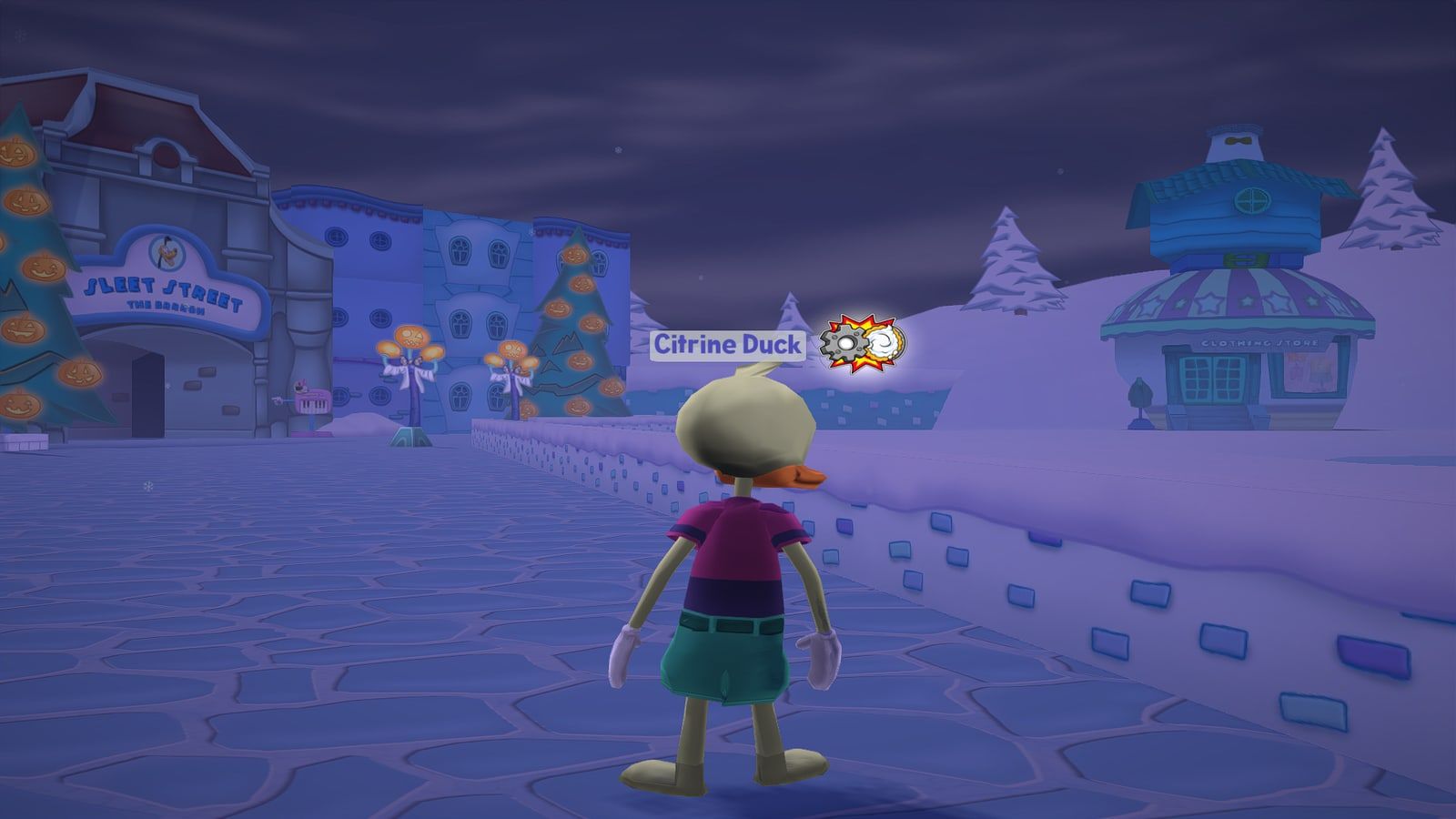 A Toon in the snow of The Brrrgh, with the shops and Halloween lights behind.